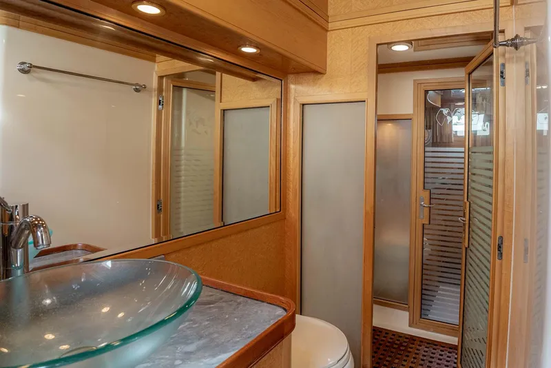 Slide: The Image of Luxurious 2006 Marlow 72E LRC yacht interior with wooden staircase and cozy cabins. - 22
