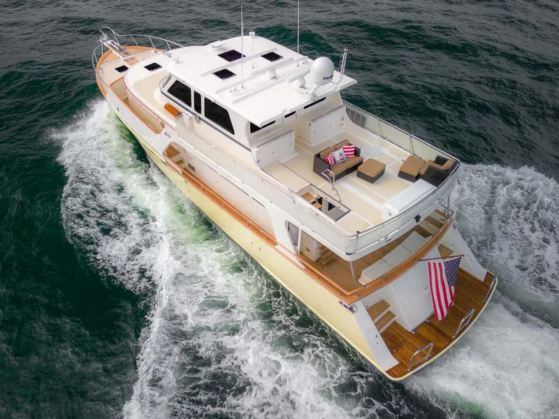 Slide: The Image of 2006 Marlow 72E LRC yacht cruising on open sea under cloudy sky. - 3