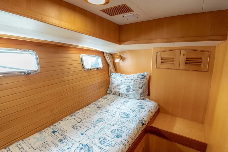 Slide: The Image of Luxurious bedroom interior of 2006 Marlow 72E LRC yacht with cozy bedding. - 32