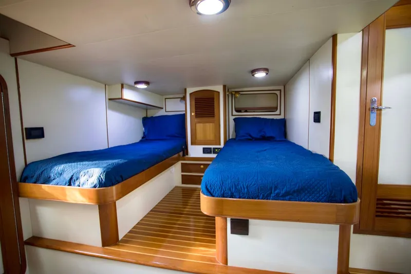 Slide: The Image of Luxurious bathroom in 2006 Marlow 72E LRC yacht with wooden cabinetry and shower. - 34