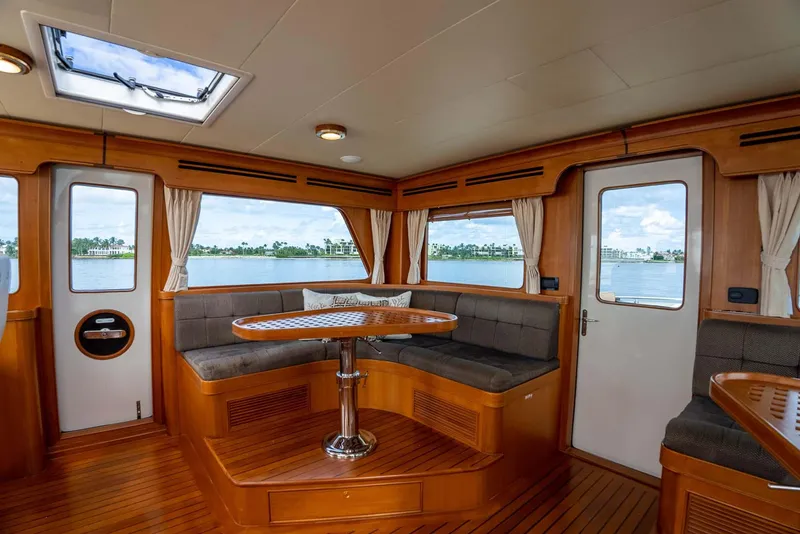 Slide: The Image of Luxurious interior of 2006 Marlow 72E LRC yacht with wooden flooring and seating. - 41