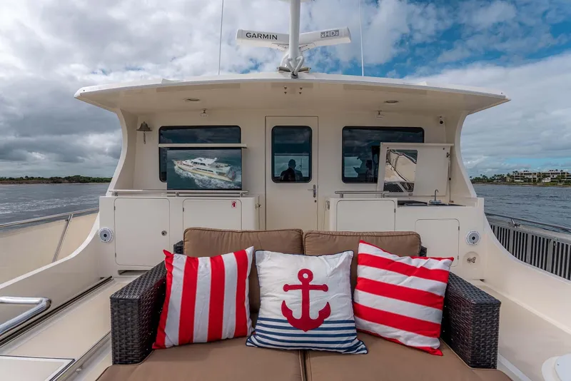 Slide: The Image of Luxurious helm of 2006 Marlow 72E LRC yacht with dual captain chairs and navigation equipment. - 45