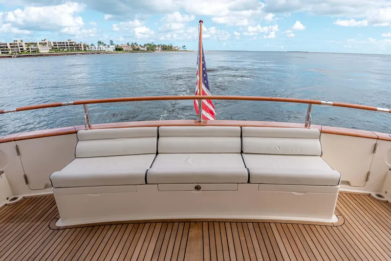 Slide: The Image of Luxurious 2006 Marlow 72E LRC yacht interior with wood finish and waterfront view. - 48