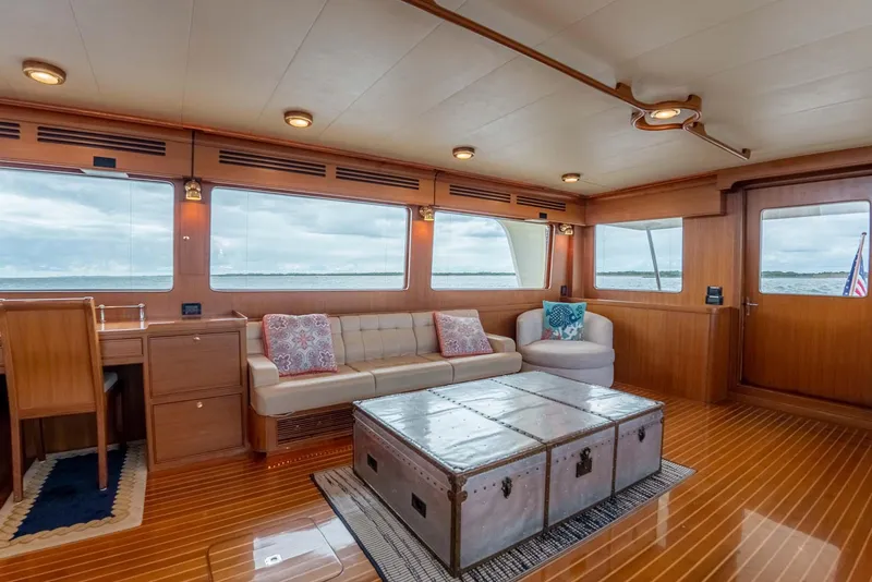 Slide: The Image of Deck of a 2006 Marlow 72E LRC with wooden stairs and windows. - 6