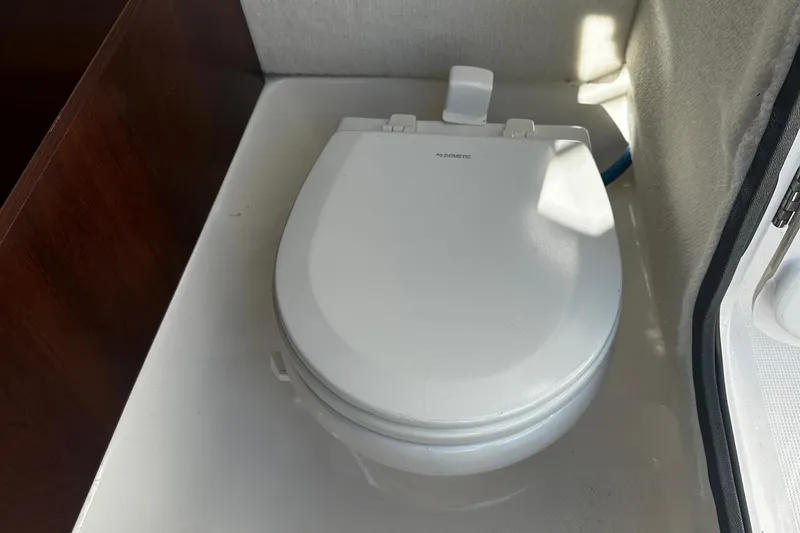 Slide: The Image of Boat toilet in 2018 Robalo R227 Dual Console cabin. - 11