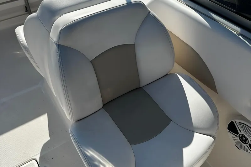 Slide: The Image of 2018 Robalo R227 Dual Console boat seat with gray and white upholstery. - 14