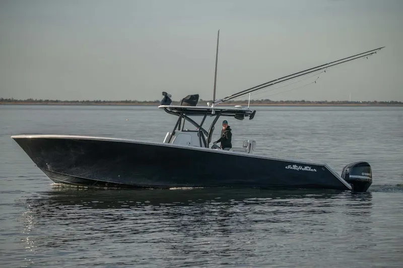 Slide: The Image of 2016 SeaHunter 35 Tournament boat cruising on calm waters. - 2