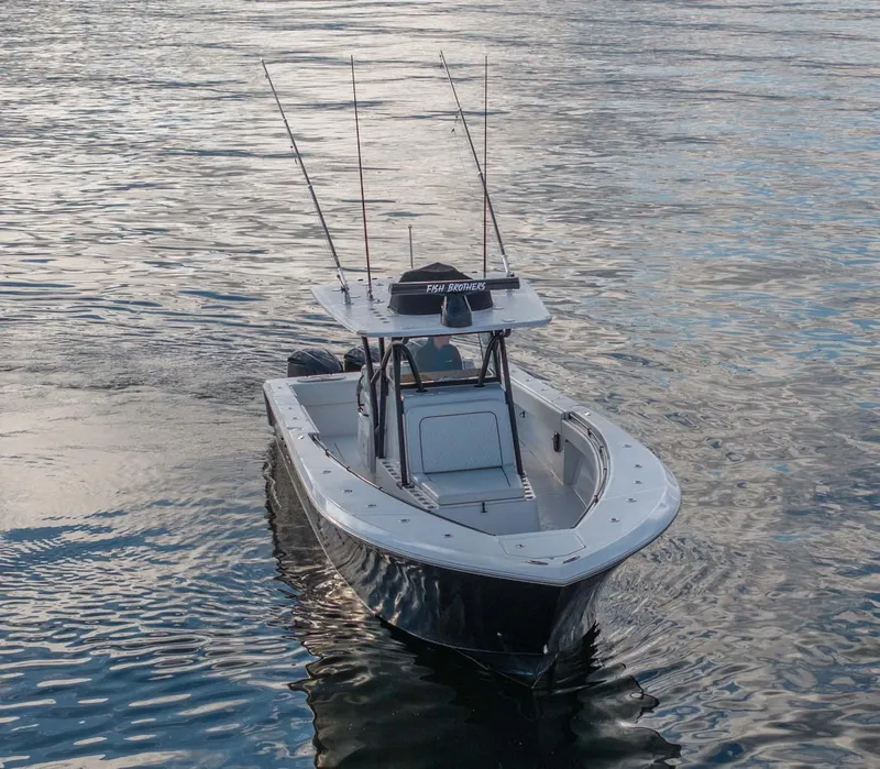 Slide: The Image of 2016 SeaHunter 35 Tournament boat on calm water, equipped for fishing. - 4