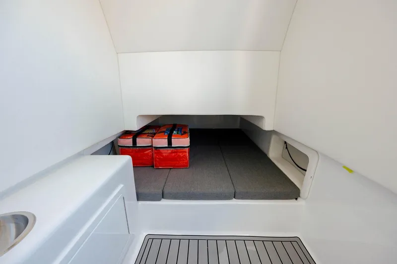 Slide: The Image of 2022 Front Runner 39 Center Console cabin interior with storage and seating. - 14