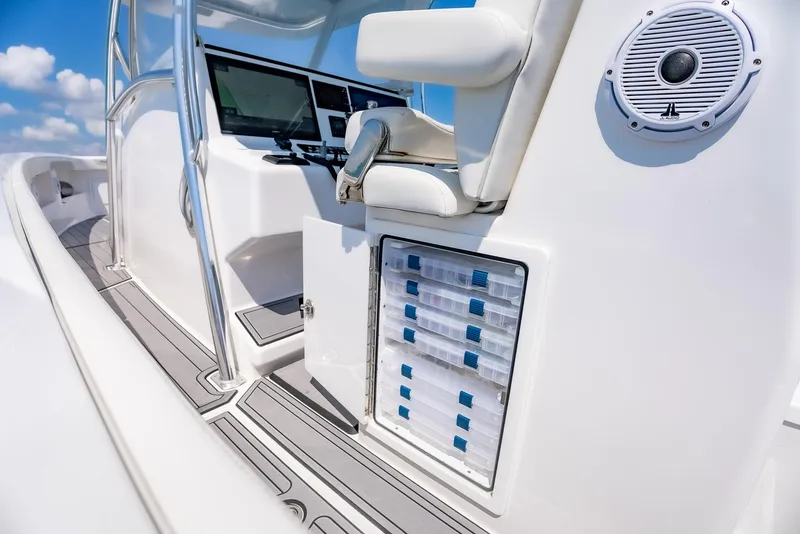 Slide: The Image of 2022 Front Runner 39 Center Console boat interior with modern controls and seating. - 17