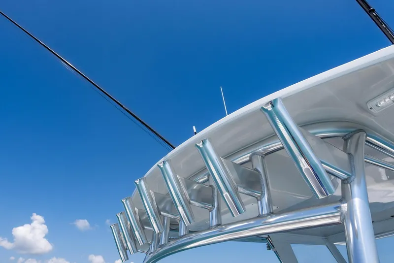 Slide: The Image of 2022 Front Runner 39 Center Console boat with rod holders against blue sky. - 18