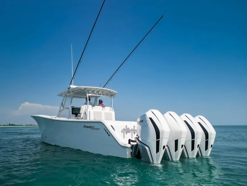 Slide: The Image of 2022 Front Runner 39 Center Console boat on open water, featuring four powerful engines. - 23
