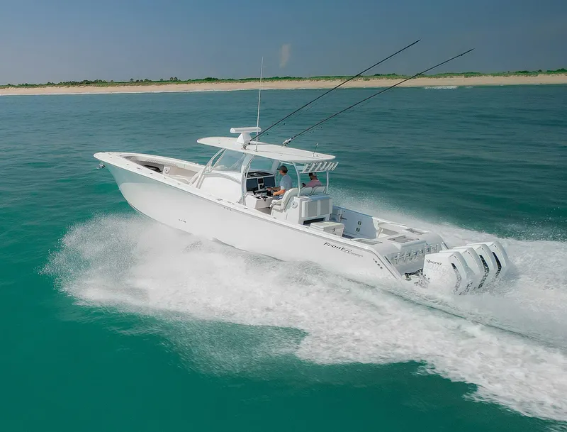 Slide: The Image of 2022 Front Runner 39 Center Console boat cruising on turquoise water. - 25