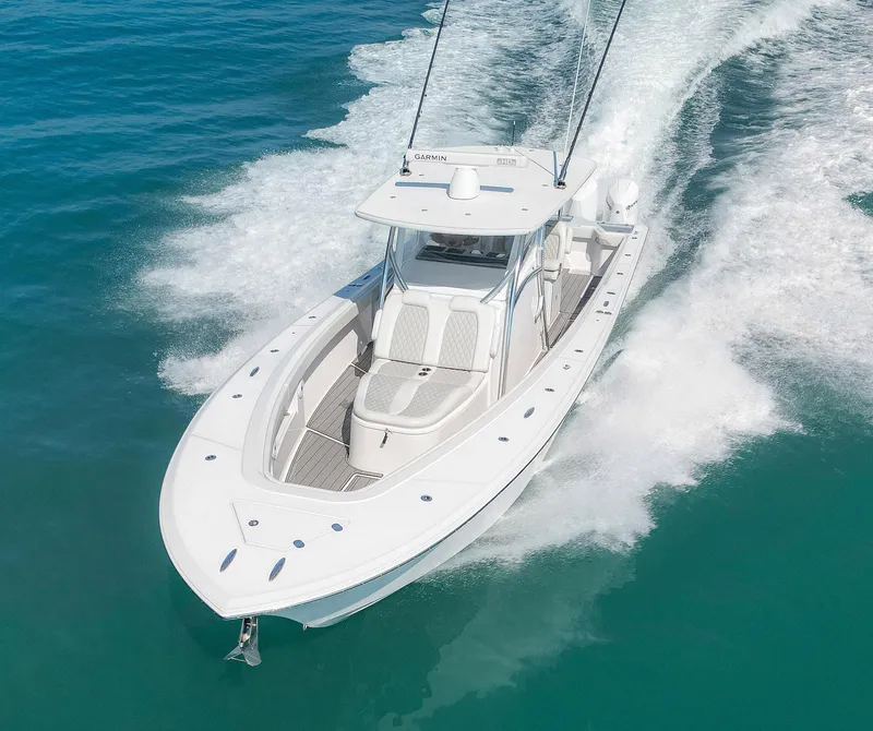 Slide: The Image of 2022 Front Runner 39 Center Console boat cruising on clear blue water. - 31