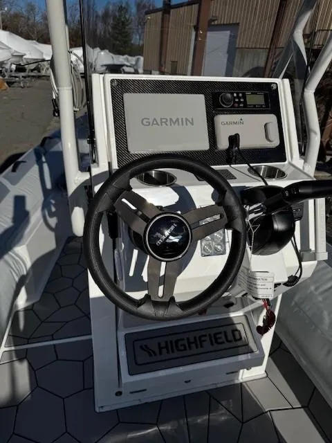 Slide: The Image of Highfield Sport 560 boat dashboard with Garmin navigation, 2025 model. - 13