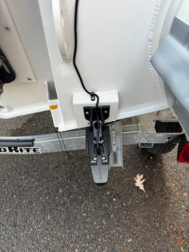 Slide: The Image of Highfield Sport 390 boat trailer hitch, 2025 model, on asphalt surface. - 2