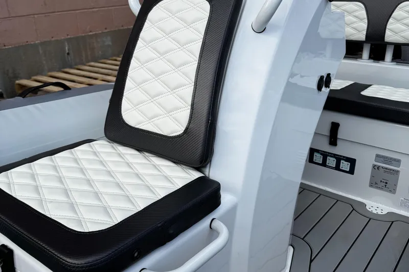 Slide: The Image of 2025 Highfield Sport 390 boat interior with quilted seats and modern design. - 3