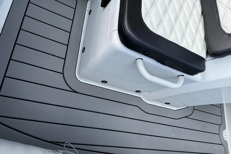 Slide: The Image of Highfield Sport 390 boat interior, featuring sleek black and white seating, 2025 model. - 4
