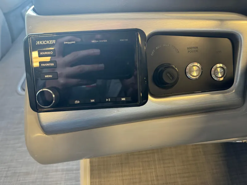 Slide: The Image of 2021 Regency 250 DL3 control panel with Kicker audio system and power settings. - 13