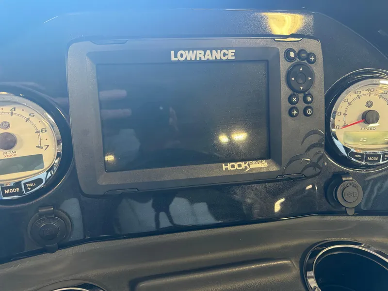 Slide: The Image of Dashboard of 2021 Regency 250 DL3 with Lowrance Hook Reveal display. - 14