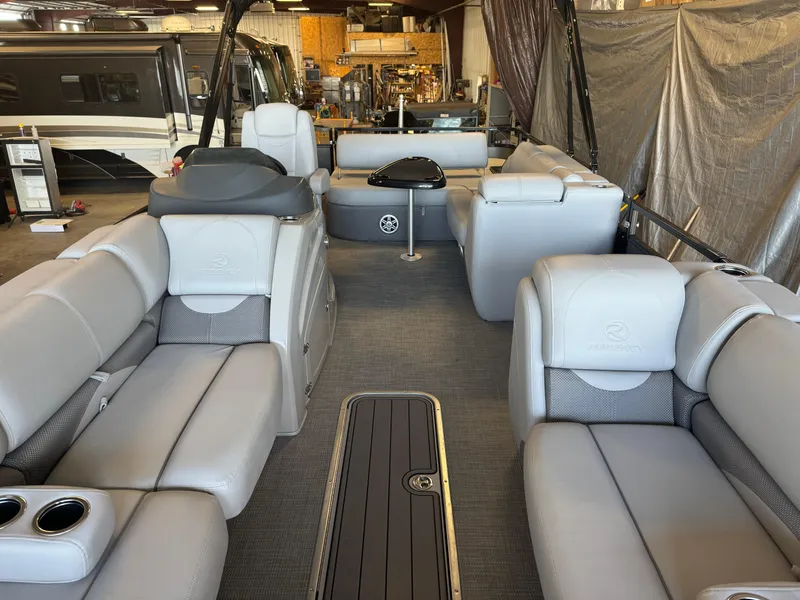 Slide: The Image of 2021 Regency 250 DL3 pontoon boat interior with luxurious seating and modern design. - 7