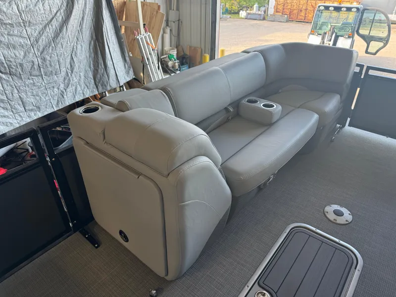 Slide: The Image of 2021 Regency 250 DL3 boat interior with gray seating and cup holders. - 9