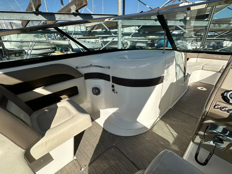 Slide: The Image of Interior of 2013 Sea Ray 300 SLX boat with seating and control panel. - 11