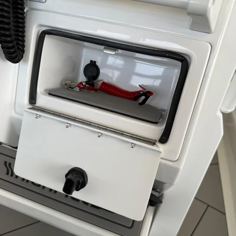 Slide: The Image of 2025 Highfield Sport 700 boat speakers and console, displayed indoors with Yamaha banner. - 12