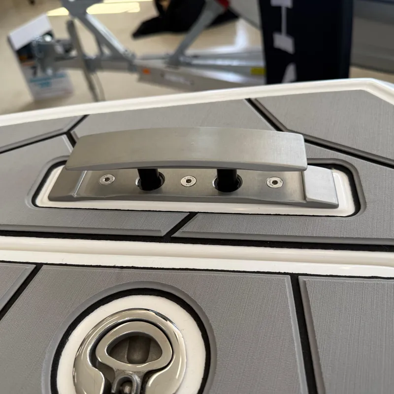 Slide: The Image of Storage compartment of 2025 Highfield Sport 700 with a cardboard box labeled "Atmos." - 16