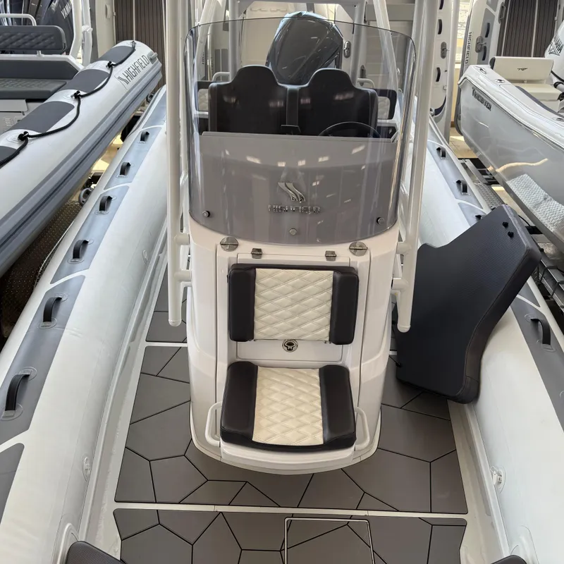 Slide: The Image of 2025 Highfield Sport 700 boat interior showing battery compartment and wiring. - 21