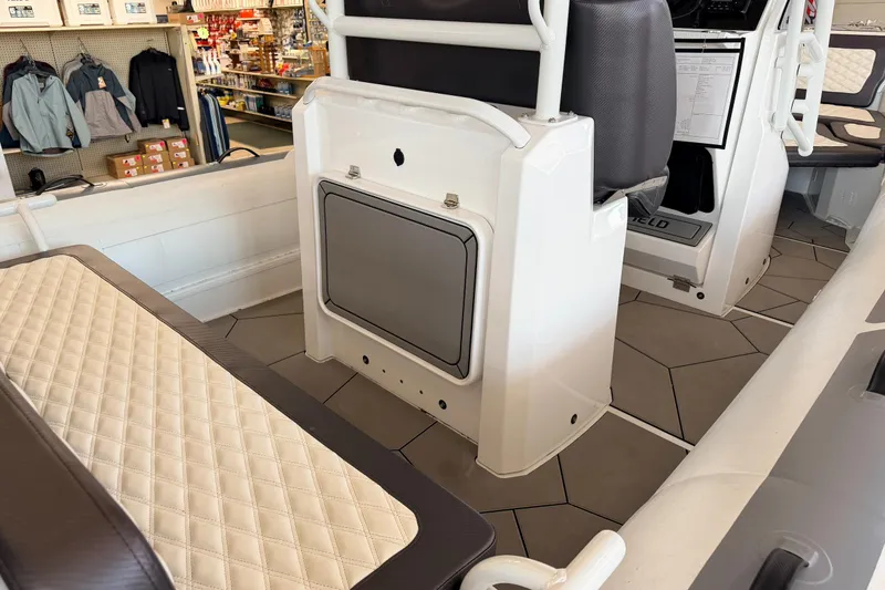 Slide: The Image of Interior of 2025 Highfield Sport 700 boat, featuring seating and storage compartments. - 35