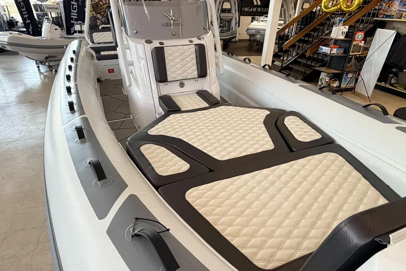 Slide: The Image of Highfield Sport 700 boat interior, 2025 model, featuring quilted seating and modern design. - 36