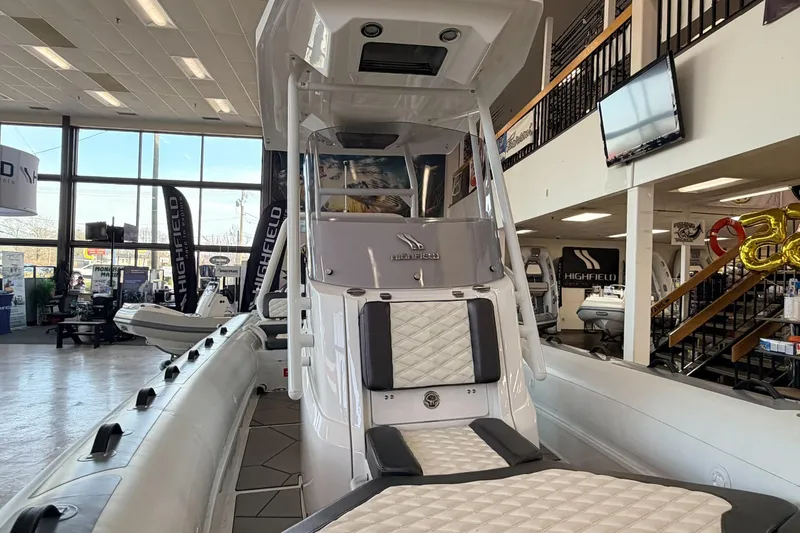 Slide: The Image of Highfield Sport 700 boat, 2025 model, displayed in a showroom with modern interior design. - 37