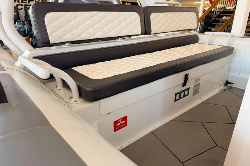 Slide: The Image of 2025 Highfield Sport 700 boat interior with cushioned seating and modern design. - 39