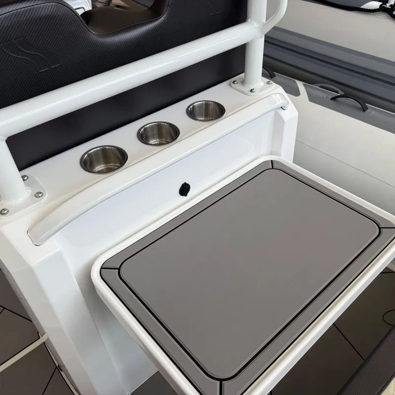 Slide: The Image of 2025 Highfield Sport 700 boat interior with steering console and seating. - 6