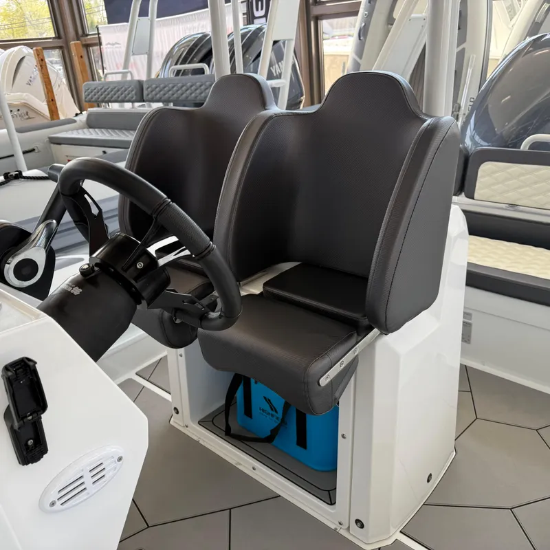 Slide: The Image of 2025 Highfield Sport 700 boat interior with cup holders and foldable table. - 7