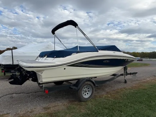 Slide: The Image of 2018 Sea Ray SPX 190 boat on trailer under cloudy sky. - 3