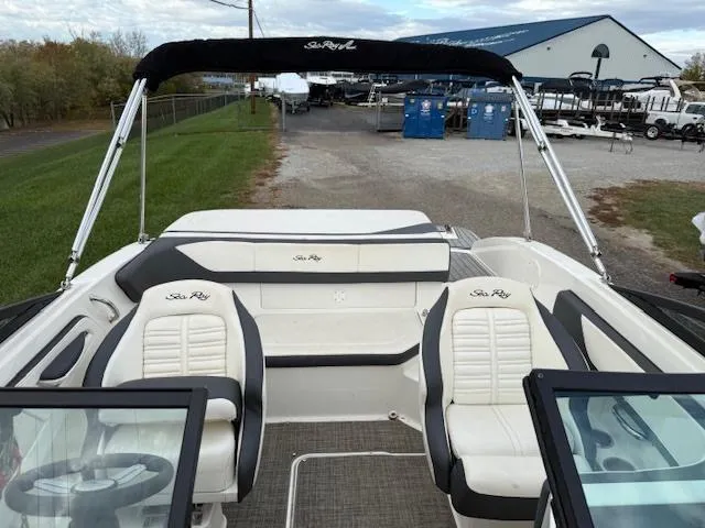 Slide: The Image of 2018 Sea Ray SPX 190 boat interior with white seating and black accents. - 8