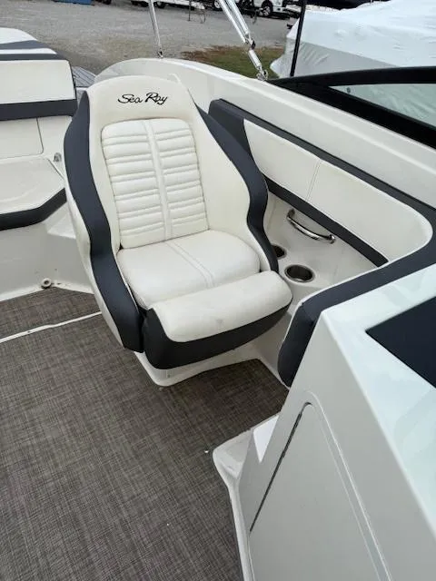 Slide: The Image of 2018 Sea Ray SPX 190 boat interior with white and gray seating. - 9