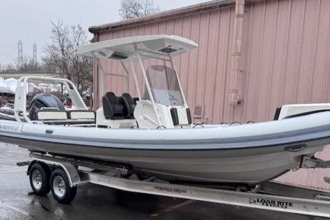 Slide: The Image of 2025 Highfield Sport 760 boat on trailer, parked outdoors. - 0