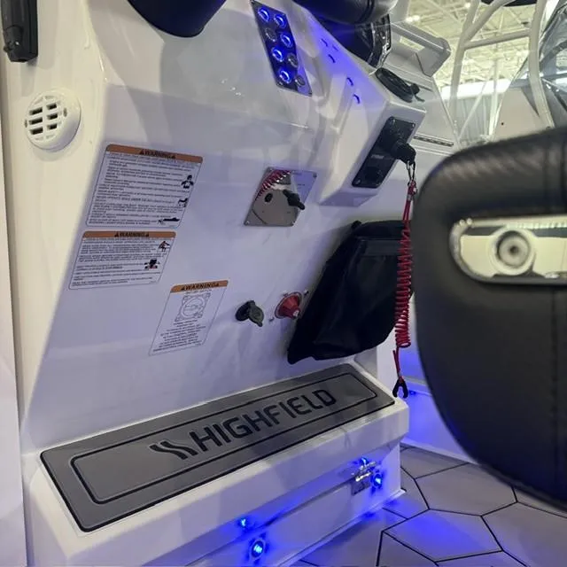 Slide: The Image of Highfield Sport 760 boat interior console with controls, 2025 model. - 12