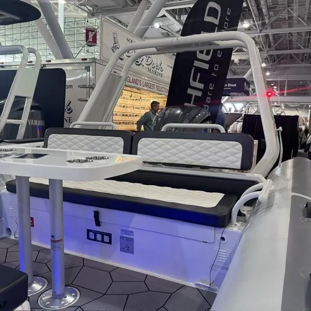 Slide: The Image of 2025 Highfield Sport 760 boat interior with seating and table at a marine exhibition. - 13