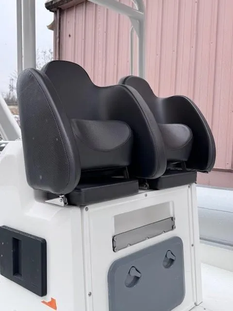 Slide: The Image of 2025 Highfield Sport 760 boat seats with black cushions and white console. - 4