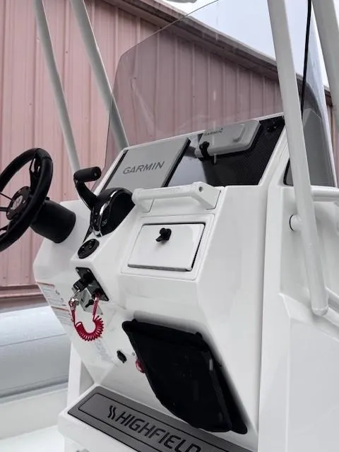 Slide: The Image of 2025 Highfield Sport 760 boat console with Garmin navigation system. - 5