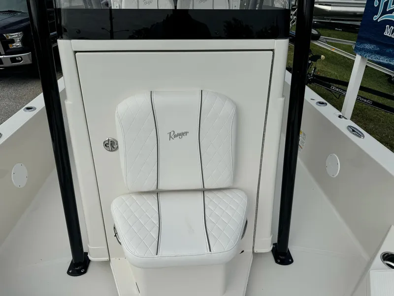 Slide: The Image of 2025 Ranger 2360 Bay boat interior with portable toilet and fire extinguisher. - 12