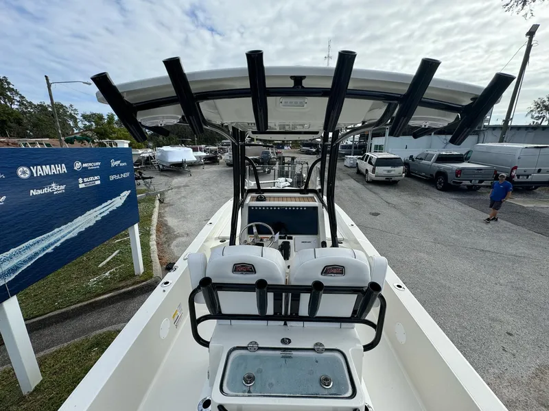 Slide: The Image of 2025 Ranger 2360 Bay boat on trailer, parked outdoors. - 6