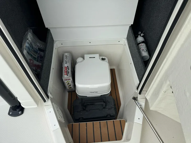 Slide: The Image of 2025 Ranger 2360 Bay boat interior with helm and seating, featuring modern design and controls. - 8