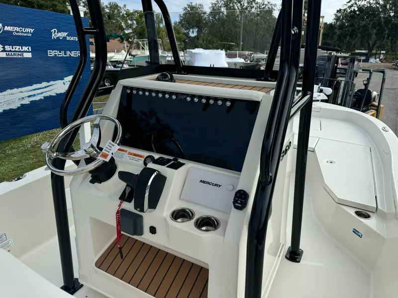 Slide: The Image of 2025 Ranger 2360 Bay boat at Holiday Marine dealership display. - 9