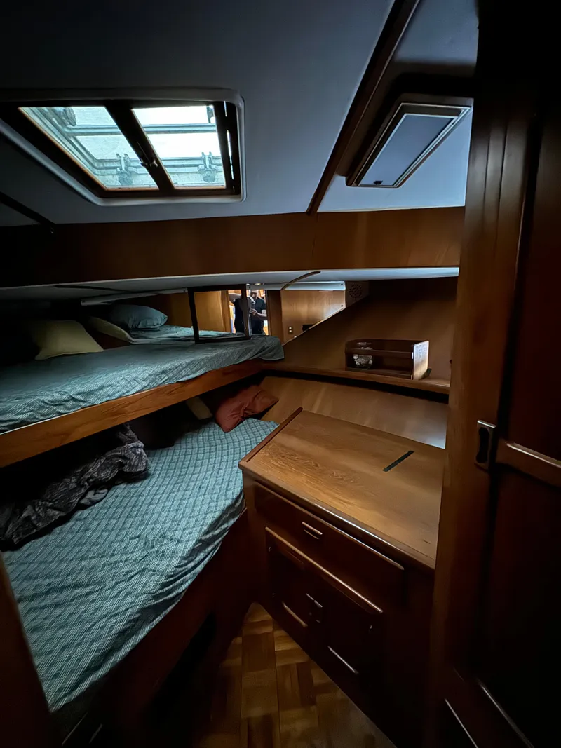 Slide: The Image of Interior cabin of 1988 Vista 43 Motor Yacht with bunk beds and wooden furnishings. - 15