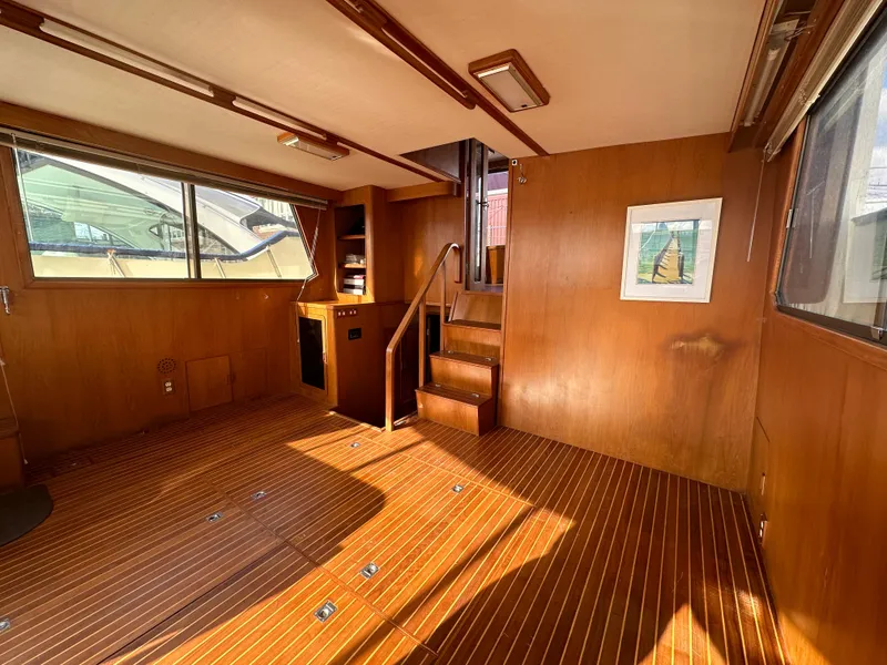 Slide: The Image of Interior of 1988 Vista 43 Motor Yacht with wooden flooring and stairs. - 20